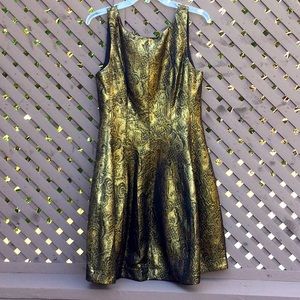 Beautiful cocktail dress, never worn with tags still on, brocade material.